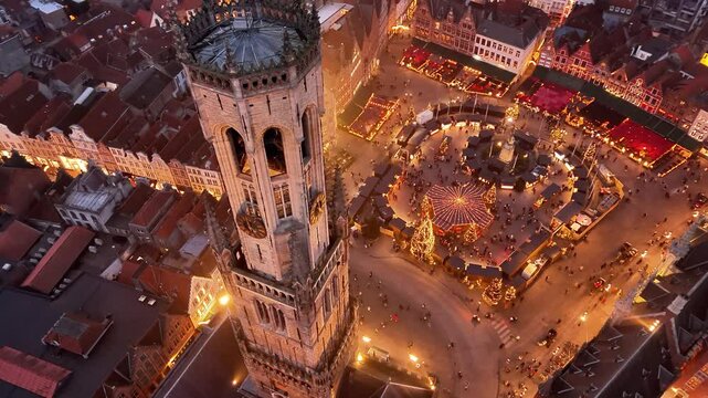 Exploring the Christmas market in Bruges at dusk with festive lights and twinkling decorations