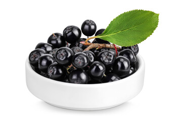 Chokeberry in ceramic bowl isolated on white background. Black aronia.