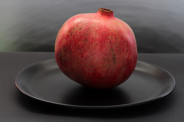 a pomegranate in a plate
