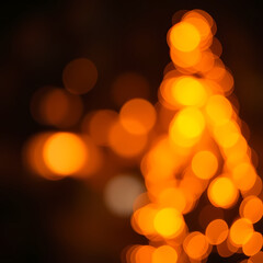 Abstract Bokeh Lights Glowing in Warm Tones Against Dark Background