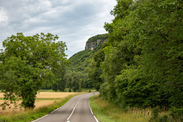 Driving car or camper on free road Route Napoleon in French Alps, touristic road in France