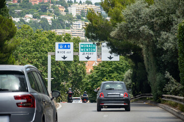 Driving car or camper on free on Cote d'azur, French Riviera in summer, road signs and directions, traffic jam on touristic road in France