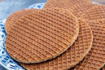 Traditional Dutch sweet dessert, Butter caramel syrup waffles, fresh baked