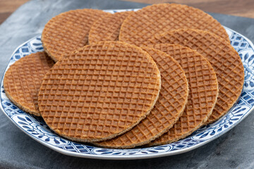 Traditional Dutch sweet dessert, Butter caramel syrup waffles, fresh baked