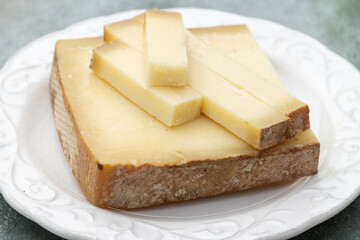 French cheese Comte, varieties unpasteurised ed milk Prestige, fruity flavoured Fruite and Vieille Reserve close up