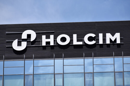 Holcim company logo, emblem, signage on the facade, Swiss building materials and aggregates company. WARSAW, POLAND - JULY 26, 2024