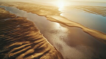 Golden sunset over the flowing river and sandy banks, creating a peaceful landscape with warm colors and serene vibes.