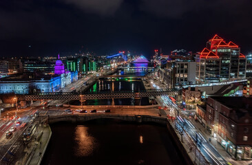 Aerial view of Dublin city center at night, illuminated by the colorful Christmas winter lights