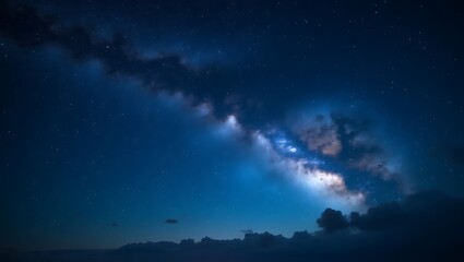 Fototapeta premium Starry night sky over the ocean with moonlight reflecting on the waves