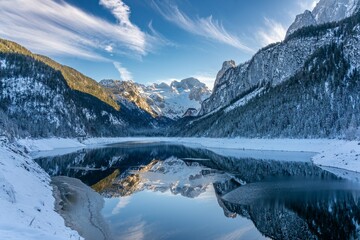 Mountain scenery in the Alps with Dachstein summit reflecting in Lake Gosausee, Salzkammergut, Austria in the Winter 