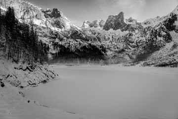 Mountain scenery in the Alps with Dachstein summit reflecting in Lake Gosausee, Salzkammergut, Austria in the Winter 