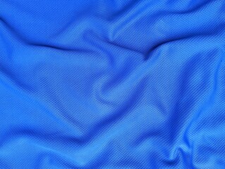 Abstrack blue silk fabric texture background. Beautiful wavy soft folds on the surface of the fabric.