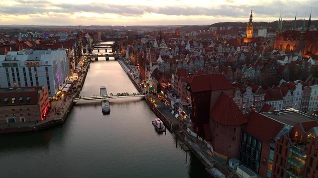 aerial flyover of gdansk city center at sunset in winter