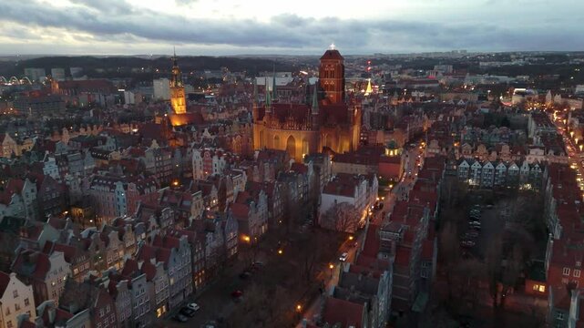 aerial flyover of gdansk city center at sunset in winter