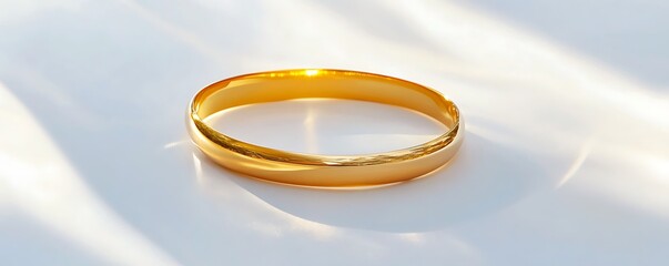A simple gold bracelet placed on a smooth white background, reflecting bright light and showcasing crisp details. contrast, white background, well-lit, sharp, realistic