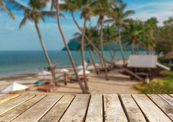 Wooden table top on the beach or sea.Party on the beach  sunshine time concept.For montage product display or design key visual layout.View of copy space.