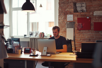 Fototapeta premium Portrait of male programmer in office. Development programmer working software and coding technology