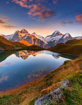 Fantastic evening panorama of Bachalp lake - Bachalpsee, Switzerland. Picturesque autumn sun