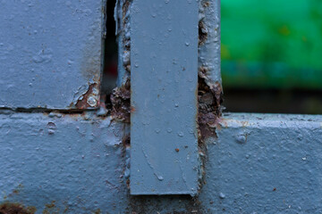 Close-up of a rusty iron door. Metal rust. Metal corrosion. Rust and corrosion on old iron.