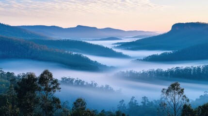 Misty Mountain Landscape At Sunrise Over Rolling Hills