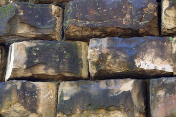 A fragment of a wall made up of large blocks of stone