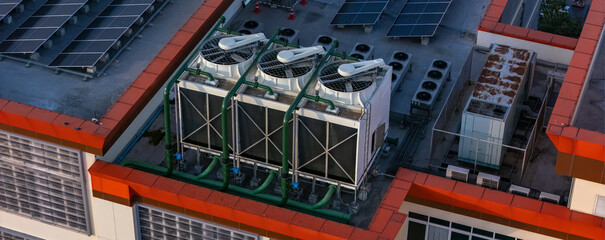 Cooling towers in data center building. Air conditioning cooling towers in front of building with...