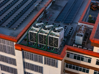 Cooling towers in data center building. Air conditioning cooling towers in front of building with...