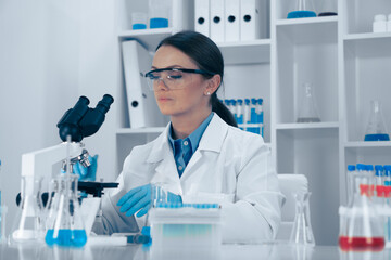A dedicated scientist analyzes samples in a stateoftheart lab using precise techniques to achieve...
