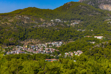 Fototapeta na wymiar Beautiful view of the buildings and the surrounding forest in Marmaris, a province of Mugla, Turkey.