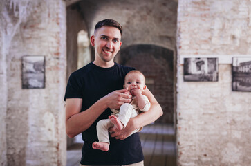 dad with baby in his arms