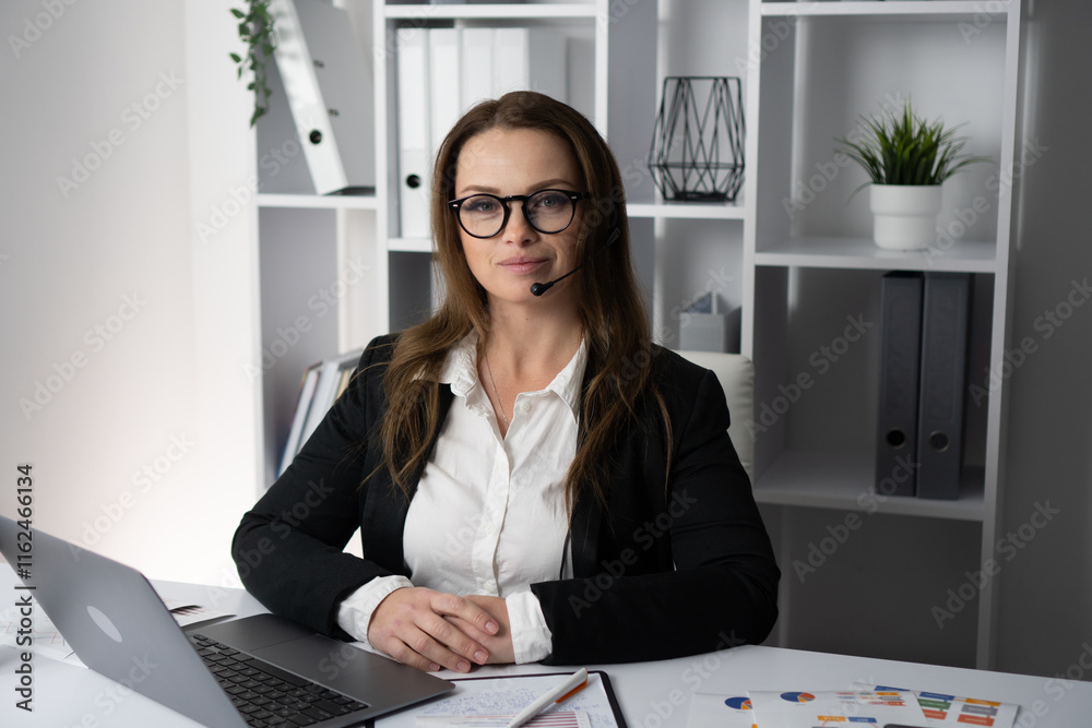 Poster this image showcases a professional woman working diligently in an office setting while wearing a he