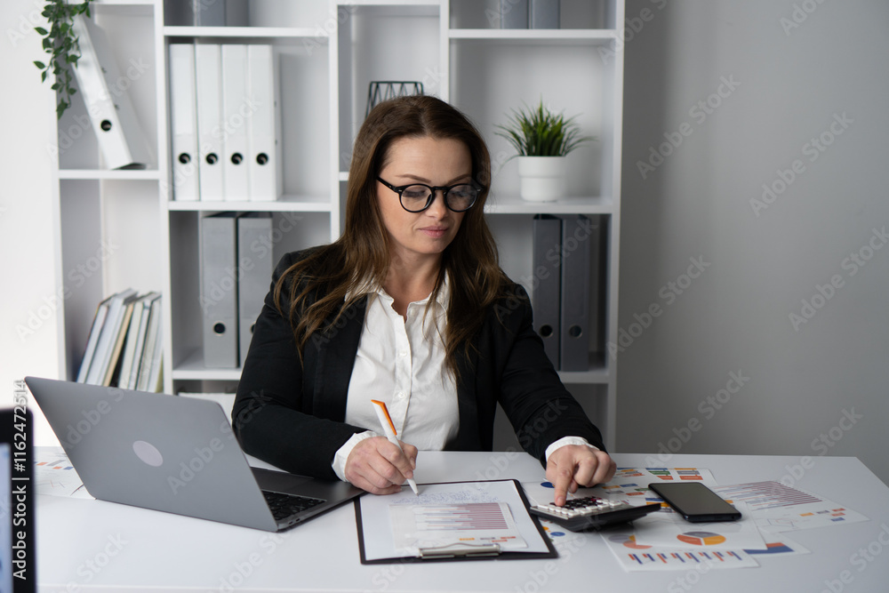 Poster a focused businesswoman is deeply analyzing important data and information while situated in a conte