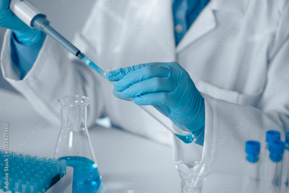 Poster A Laboratory Technician is currently engaged in conducting a detailed experiment using a pipette within a modern laboratory environment, illustrating key themes in scientific research and safety