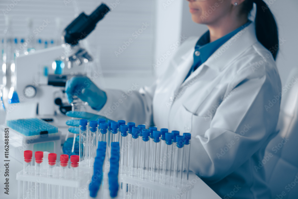Aufkleber A scientist is meticulously analyzing various samples under a highpowered microscope in a stateoftheart modern laboratory, utilizing advanced technology to gain insights into biological processes