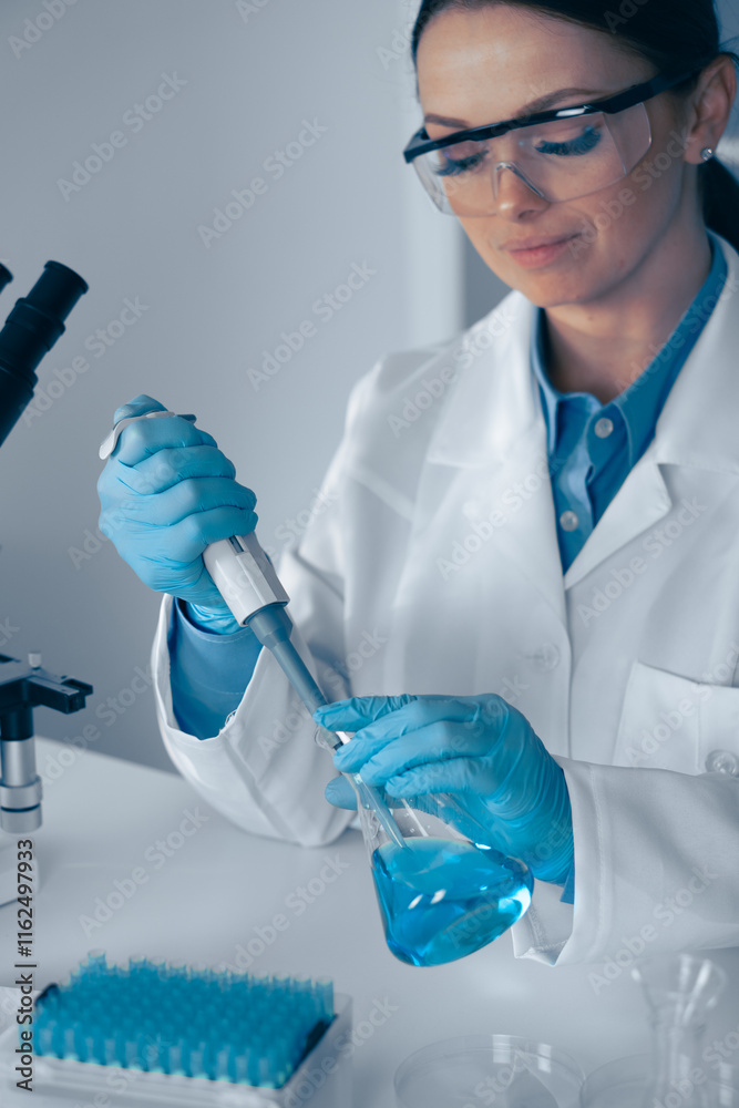 Poster a skilled scientist is meticulously performing a precise liquid transfer procedure within a wellequi