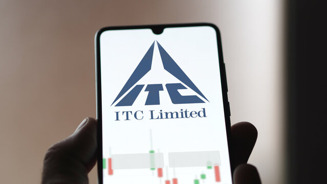 ITC limited stocks on a screen. A phone shows the prices of ITC Limited