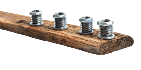 An artistic arrangement of shiny steel machine bolts on a rustic wooden plank, strikingly isolated on a white surface