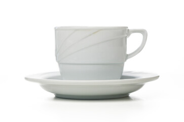 Elegant white cup and saucer captured in minimalistic style with soft lighting