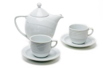 Elegant white ceramic tea set arranged for a relaxing afternoon tea ritual in serene surroundings