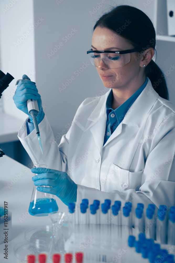 Poster a dedicated scientist is meticulously conducting various experiments in a wellequipped laboratory se
