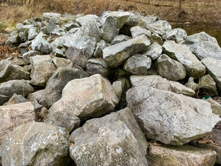 A large pile of rocks sitting on top of a pile of dirt
