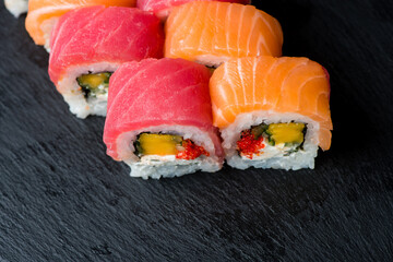 isolated sushi on black background. assorted sushi