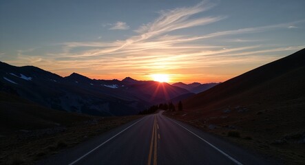 Fototapeta premium Sunset viewed through a mountain pass with the light framing the rugged terrain