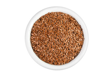 flaxseed in ceramic bowl isolated on white background. Top view. Flat lay