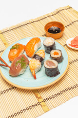 It is common to eat nigiri with your hands, although chopsticks can also be used