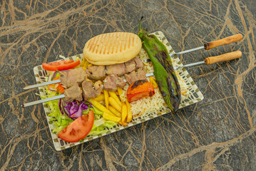 Spices: Cumin, paprika, garlic, oregano, and sometimes turmeric and cinnamon.