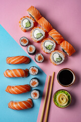 Assorted Sushi Rolls and Nigiri on Pastel Background