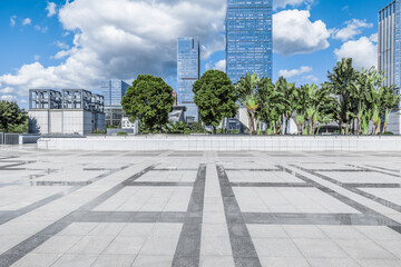 Empty brick floor and modern city buildings background