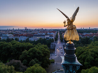 Friedensengel overlooking a beautiful sunset sky on Prinzregentenstrasse in Munich, Germany