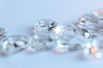 Diamonds on a white background. Macro photo with shallow depth of field.	